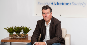 Dave Spedding, the Chief Executive Officer of the Alzheimer Society of Toronto, sitting