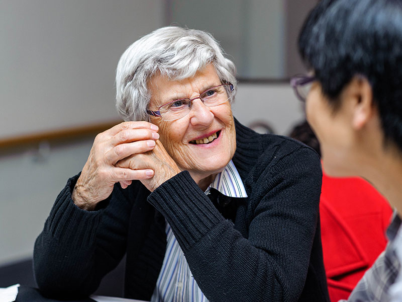 Older female in conversaton