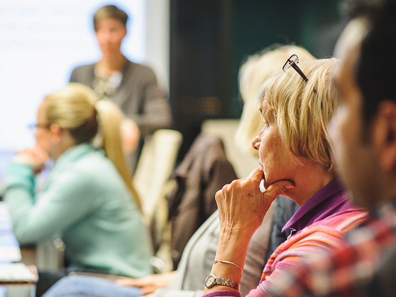 group of older adults in conversation