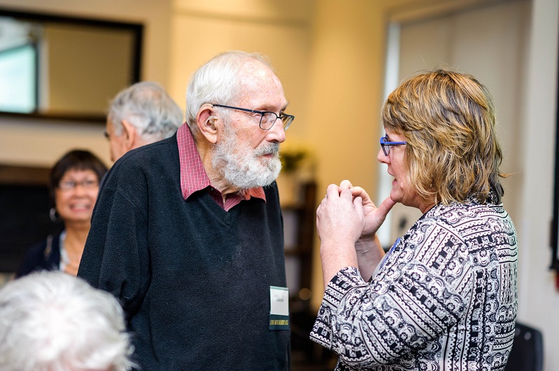 A older man and woman in conversation