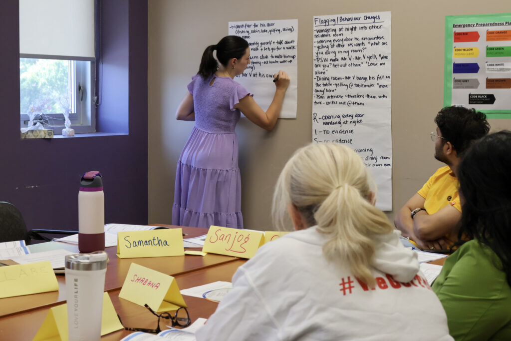 AST public educator teaching a class of PSWa