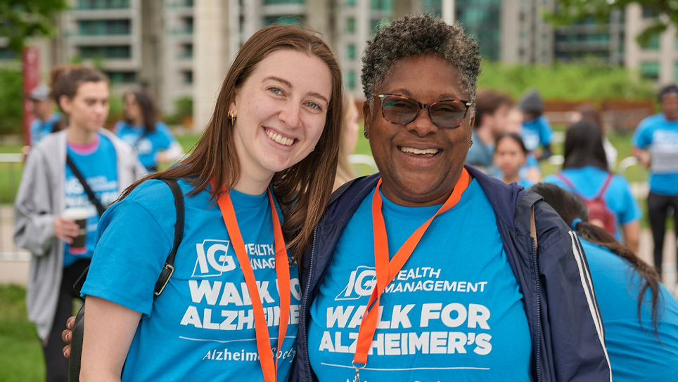 Two supporters of Alzheimers Toronto embracing during the walk for Alzheimers event.